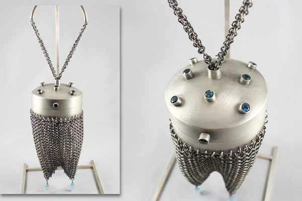 round silver chain mail purse with faceted blue topaz